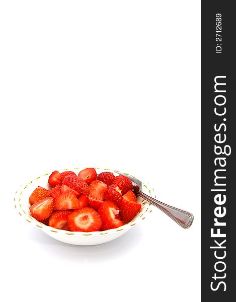Freshly cut strawberries in a bowl. Freshly cut strawberries in a bowl