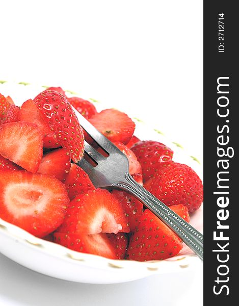 Cut strawberries in a bowl at a quirky angle. Cut strawberries in a bowl at a quirky angle.