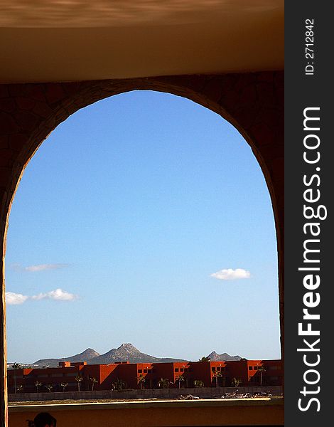 View from an arched winow to a modern hotel at Los Cabos, Baja California, Mexico, Latin America. View from an arched winow to a modern hotel at Los Cabos, Baja California, Mexico, Latin America