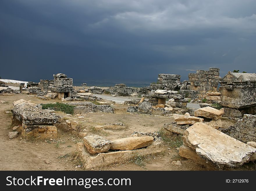 An ancient Roman necropolis, Turkey, peak of Pamukkale mountain. Shortly before thunderstorm. An ancient Roman necropolis, Turkey, peak of Pamukkale mountain. Shortly before thunderstorm