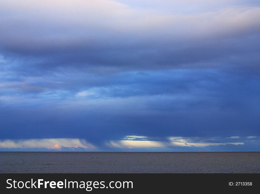 Rain clouds over the ocean at Los Cabos, Baja California, Mexico, Latin America. Rain clouds over the ocean at Los Cabos, Baja California, Mexico, Latin America