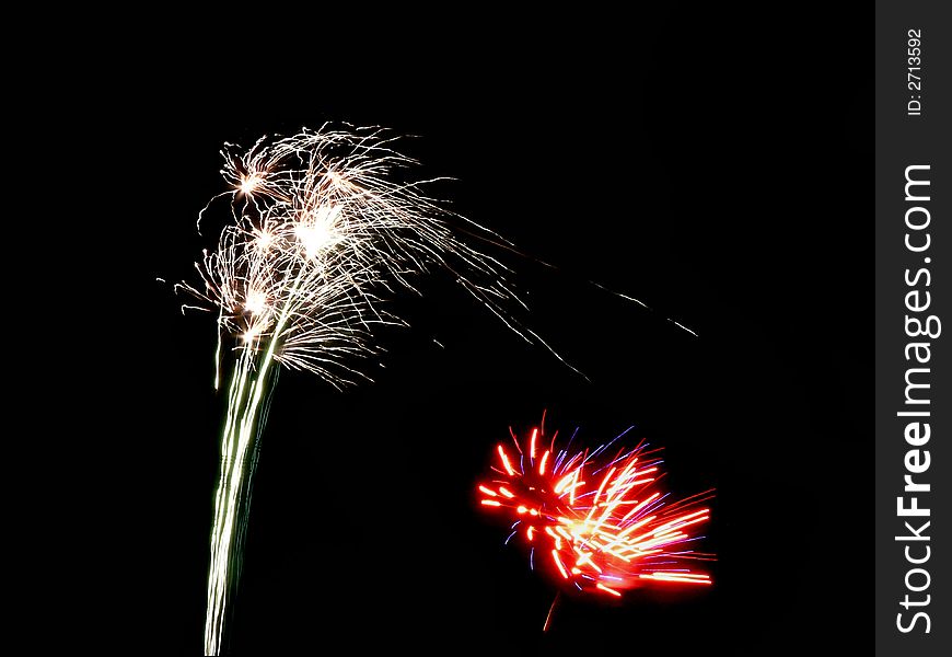 Photo of fireworks exploding on the dark sky. Photo of fireworks exploding on the dark sky.