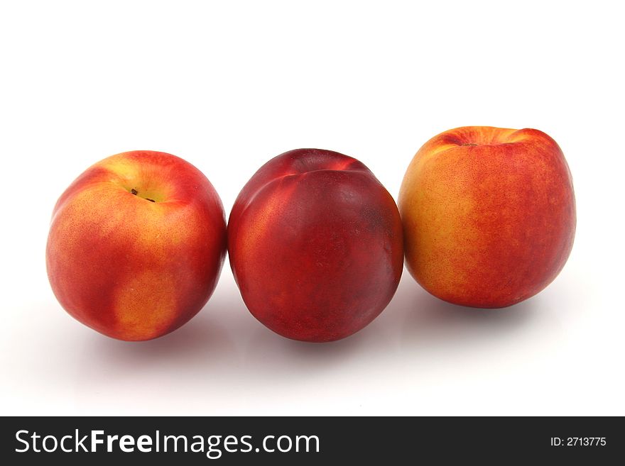 Fresh nectarines on white background