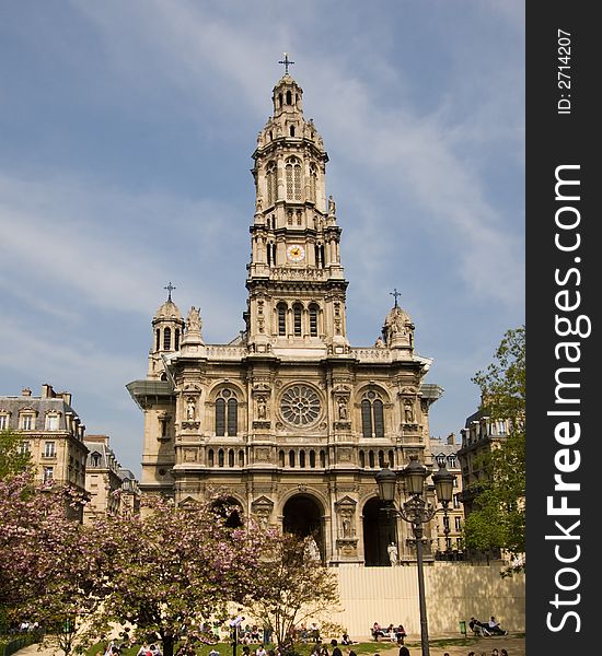 Church in Paris, France, with trees in front and a blue sky background. Church in Paris, France, with trees in front and a blue sky background