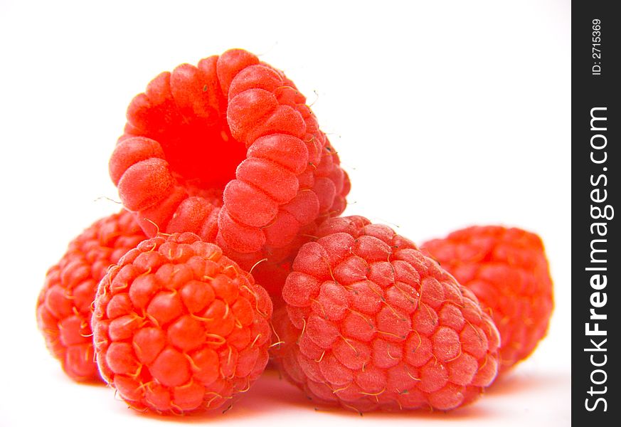 Fresh raspberries isolated over white background