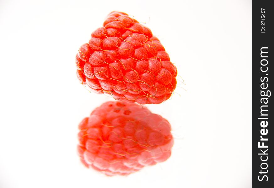 Fresh raspberry isolated over white background