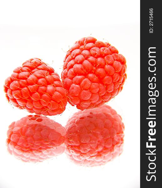 Twor raspberries isolated over white background. Twor raspberries isolated over white background