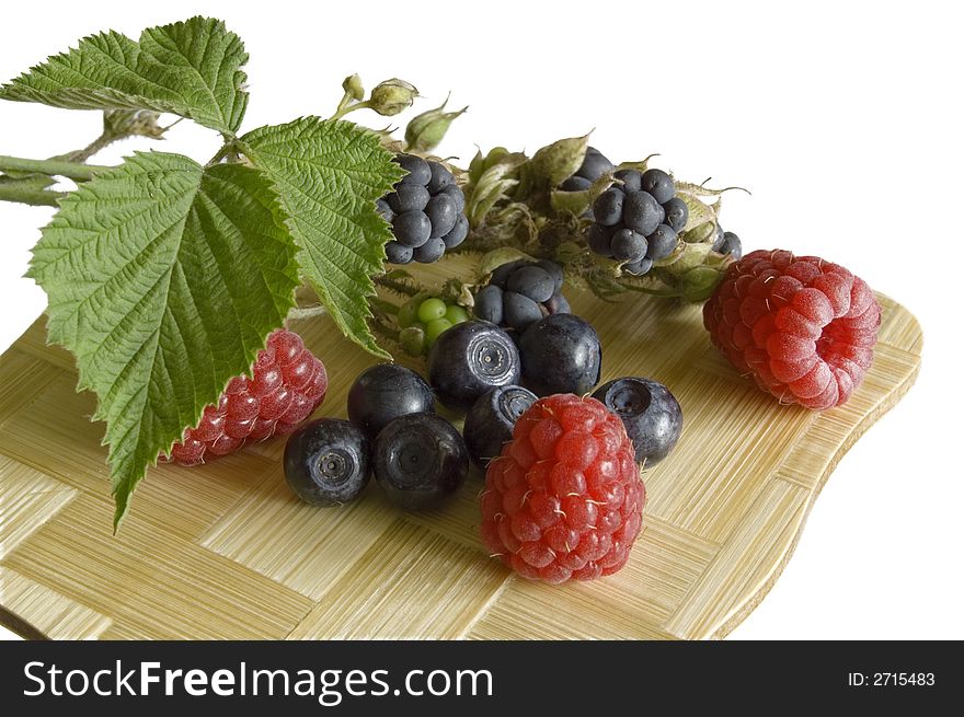 Bilberries,blackberry and raspberries, summer fruits on white