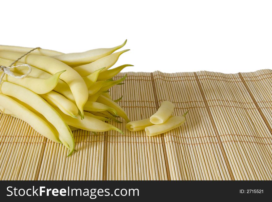 String yellow haricot pods on white isolated