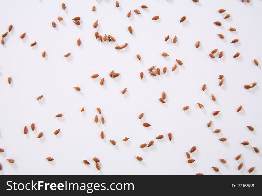 Linen seeds rain on neutral background