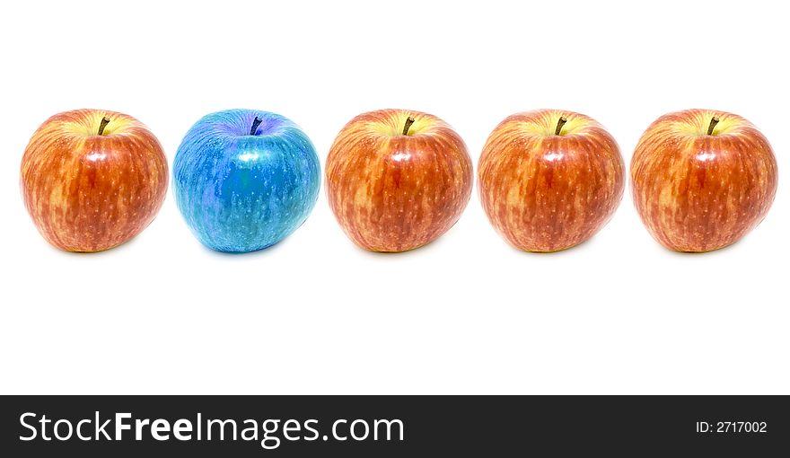 Set of red apples with one of diferent color isolated on white