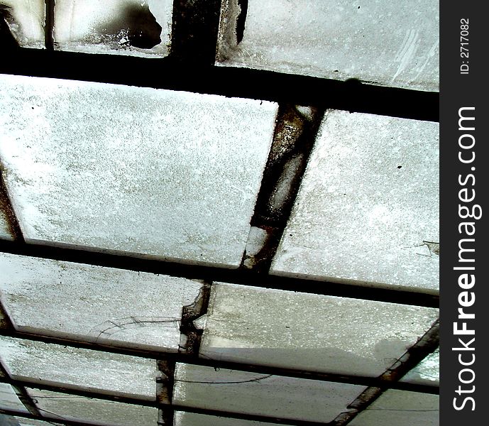 An photographic image of some dirty windows with some rusty window frames. An photographic image of some dirty windows with some rusty window frames.