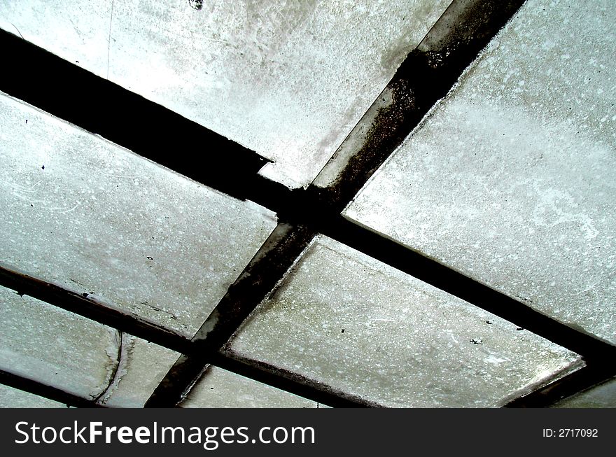 An photographic image of some dirty windows with some rusty window frames. An photographic image of some dirty windows with some rusty window frames.