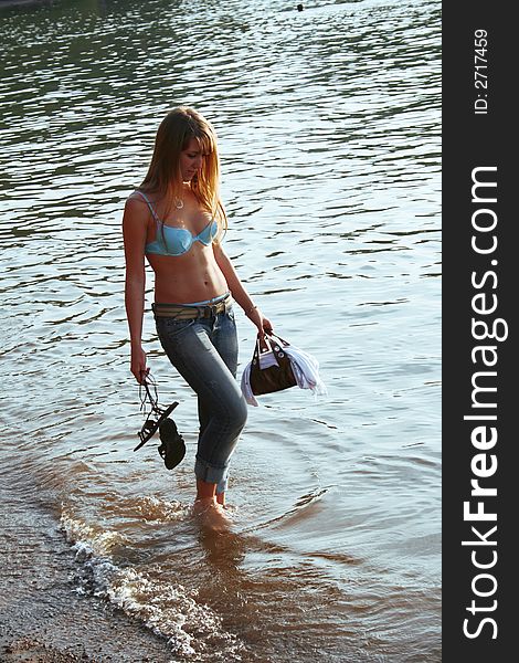 On a photo a girl is represented going for a walk on water