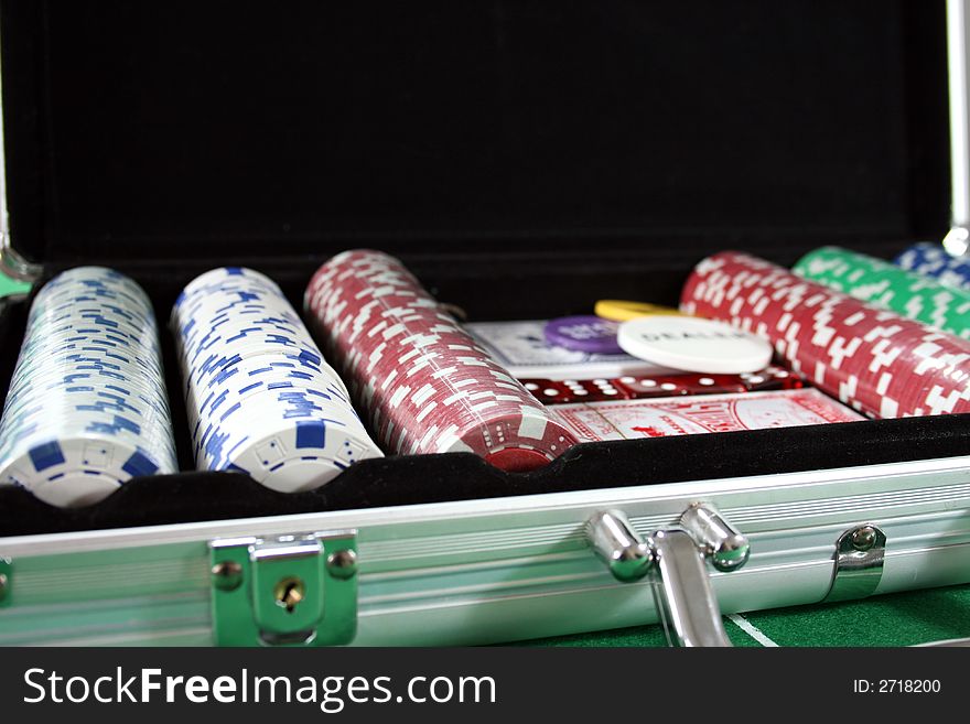 Photo of case with chips and cards for playing poker. Photo of case with chips and cards for playing poker