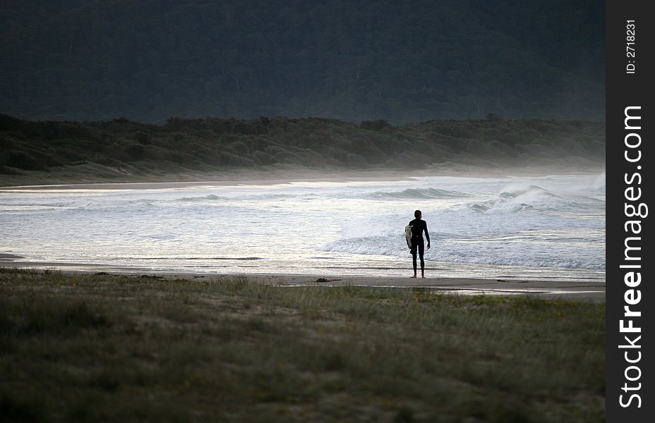 Surfer on Diamond Beach Australia. Surfer on Diamond Beach Australia