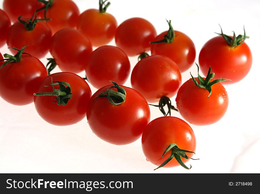 Three row of Cherry tomato on white