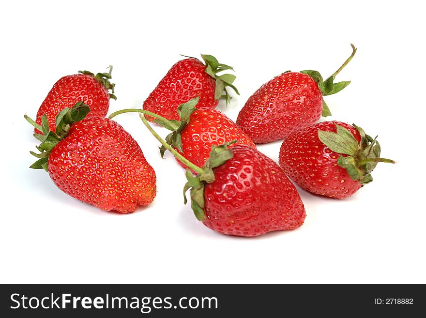 Red fresh strawberries isolated over white background