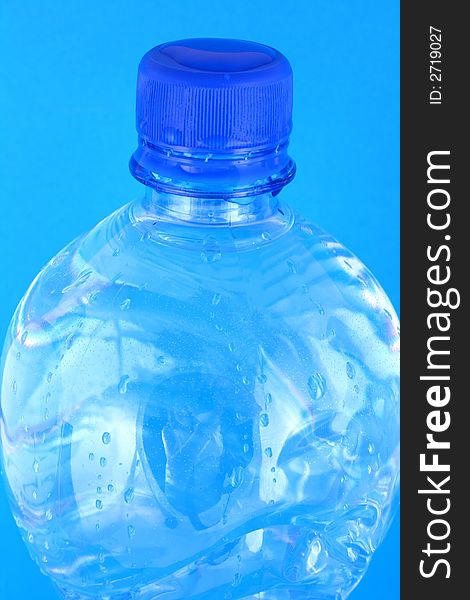 Mineral water in a blue bottle