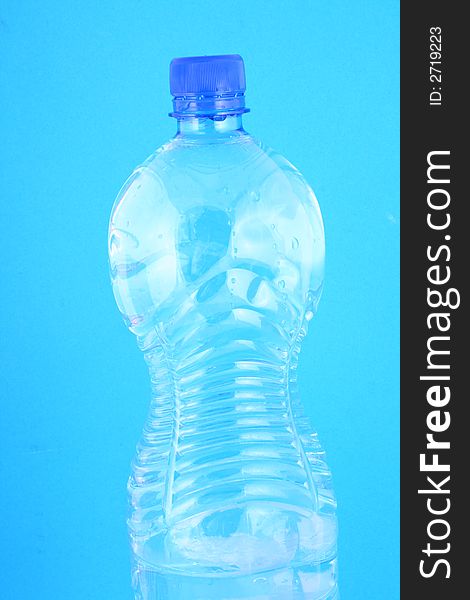 Mineral water in a blue bottle