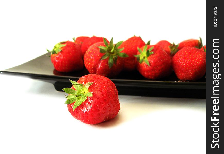 Strawberry in the dish isolated on white