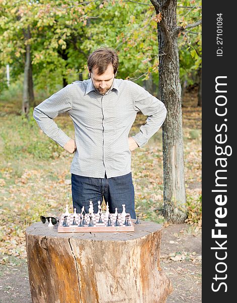 Man planning his chess strategy