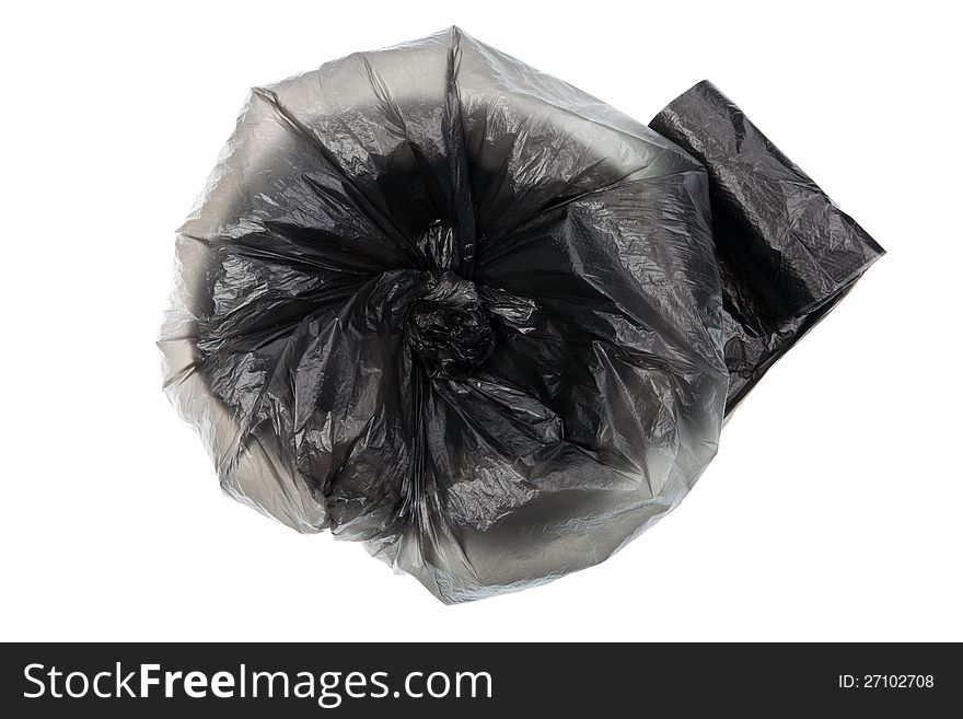 Unpacked roll of black plastic garbage bags isolated on white