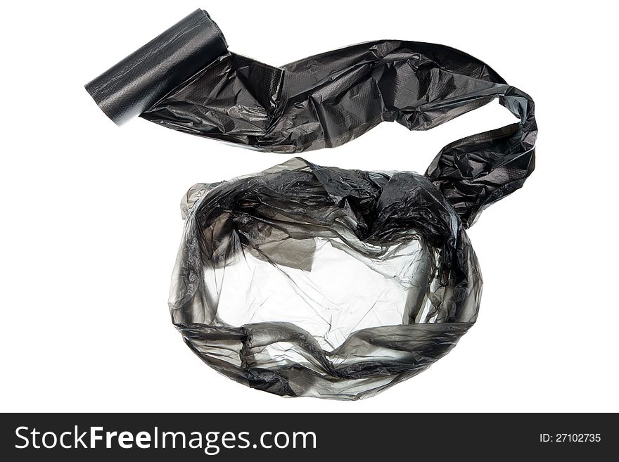 Unpacked roll of black plastic garbage bags isolated on white