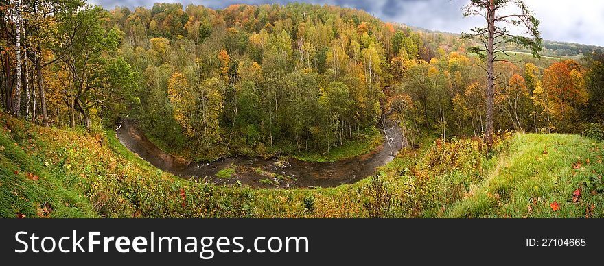 Panoramic autumn fall view of river and forest. Panoramic autumn fall view of river and forest