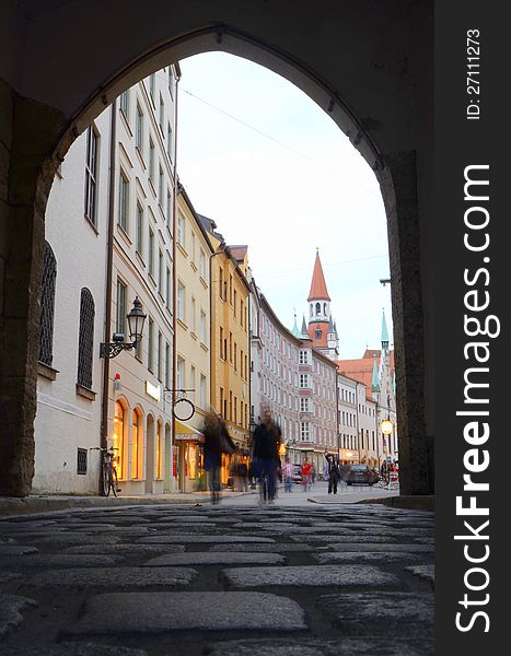 Blurred People On A Cobbled European Shopping Street