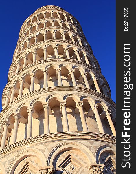 Pisa tower closeup in the morning. The clear sky is deep blue.