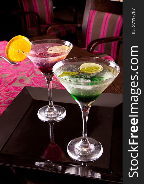 Romantic and colorful Martini cocktails with lemon and ice. Romantic and colorful Martini cocktails with lemon and ice