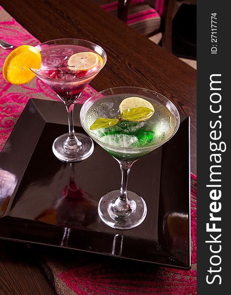 Romantic and colorful Martini cocktails with lemon and ice. Romantic and colorful Martini cocktails with lemon and ice