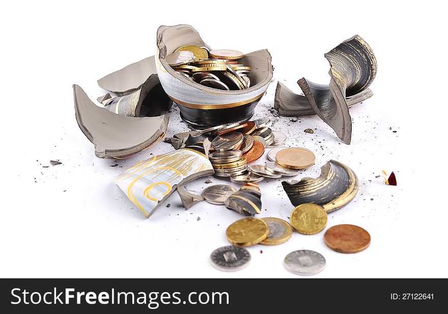 A broken vase with money inside isolated on a white background.