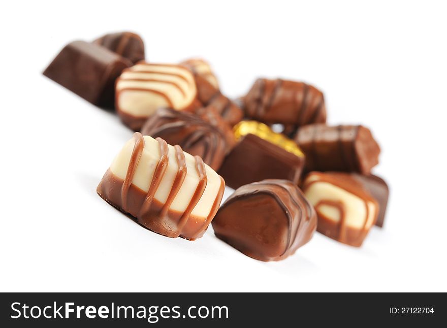 Close up of chocolate pralines isolated on a white background