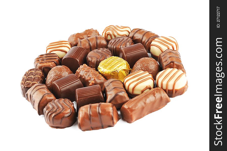 Close up of chocolate pralines isolated on a white background arranged in a circle