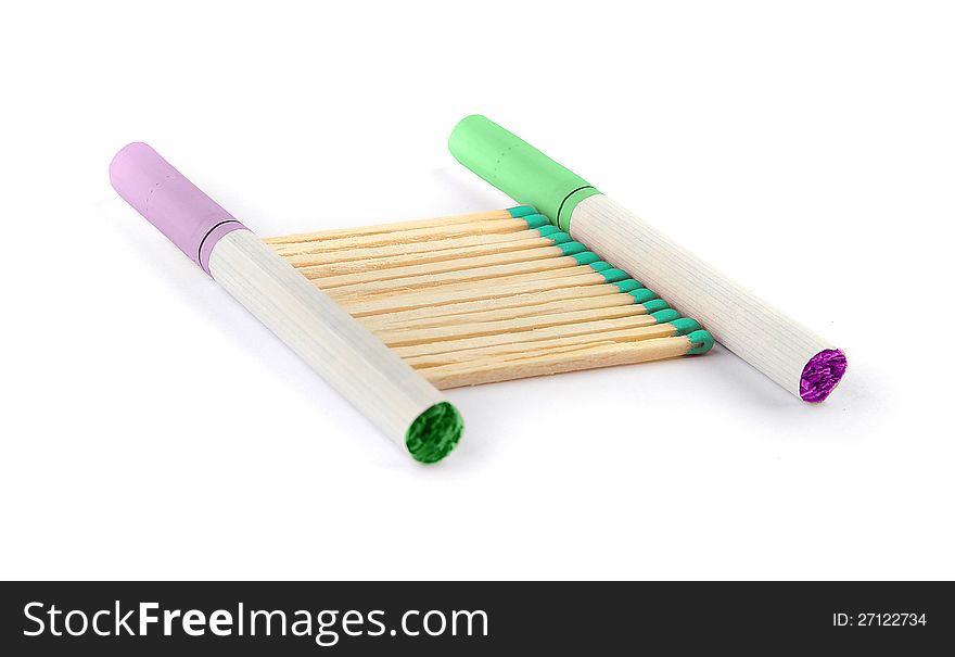 Two colored cigarettes and colored matches