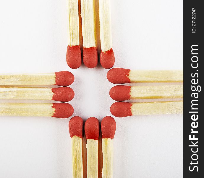 Close up of matches isolated arranged three on cross isolated on a white background. Close up of matches isolated arranged three on cross isolated on a white background.