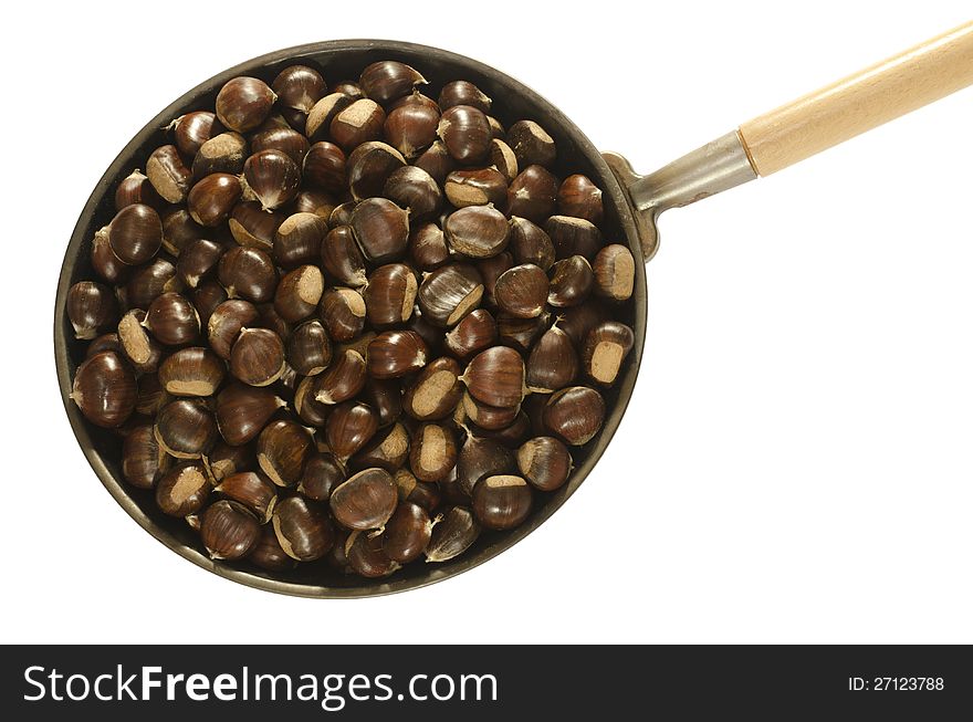 Chestnuts in a pan isolated in white with clipping path