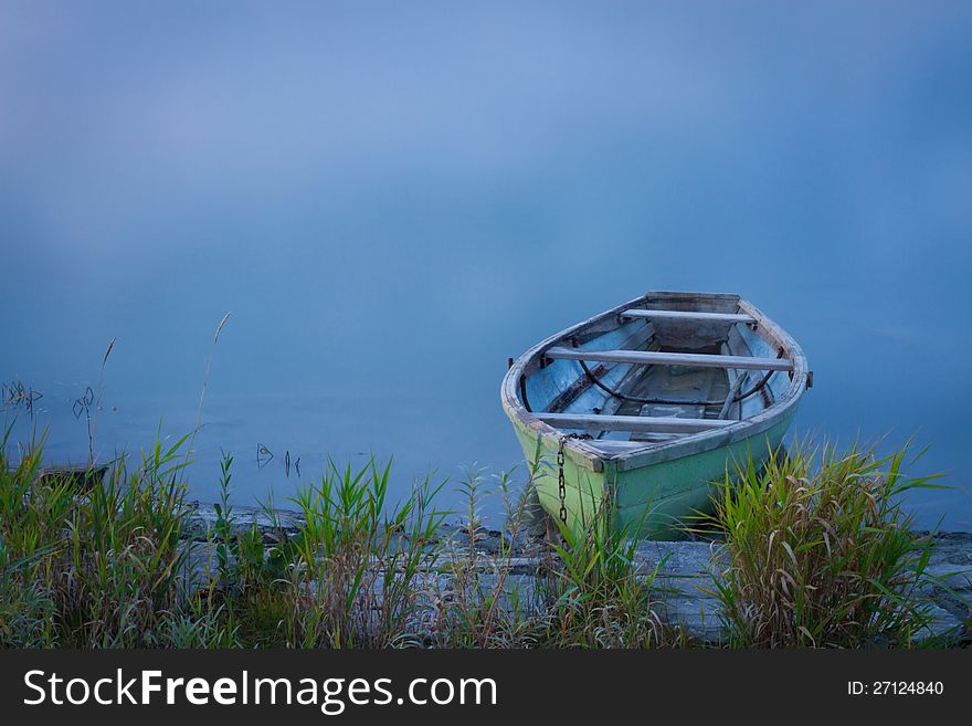 Fishing boat on the bank of the Katun River, October, Siberia. Fishing boat on the bank of the Katun River, October, Siberia.
