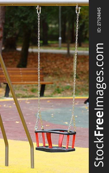 Empty swing on children playground