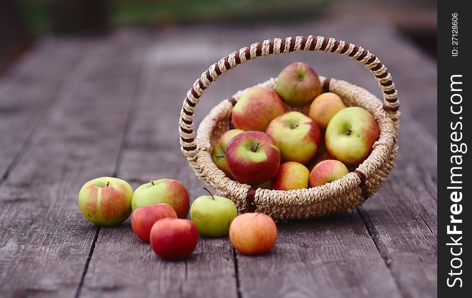 Apples in the Basket on the wooden table