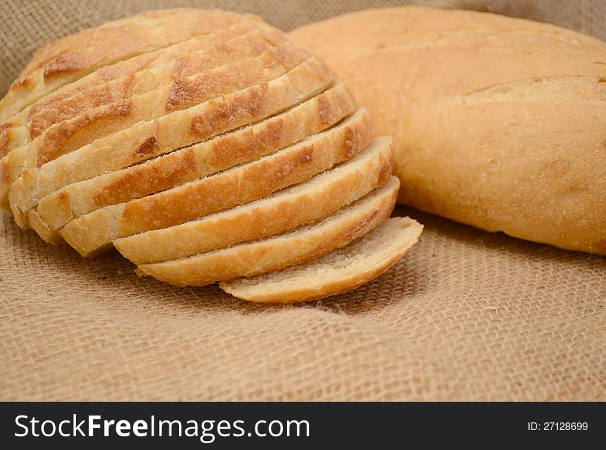 Fresh sliced bread on burlap