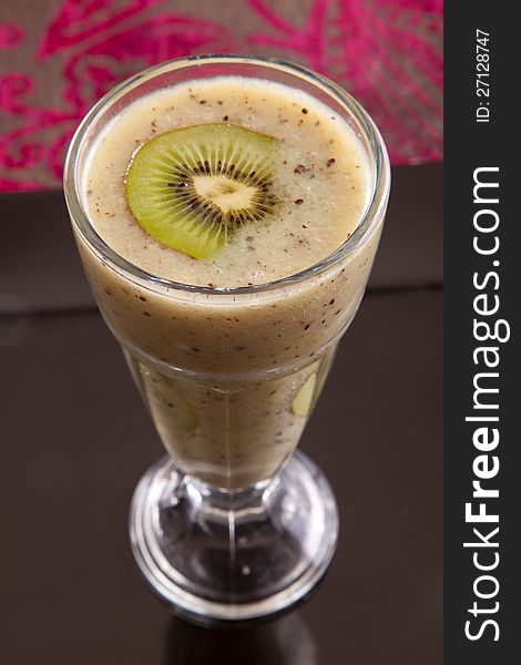 Fresh kiwi juice on white close up