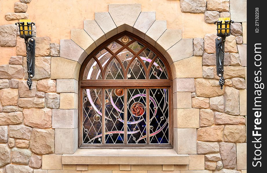 Arched window in stone wall