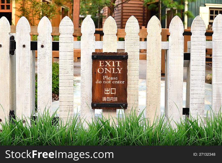 White picket fence and home