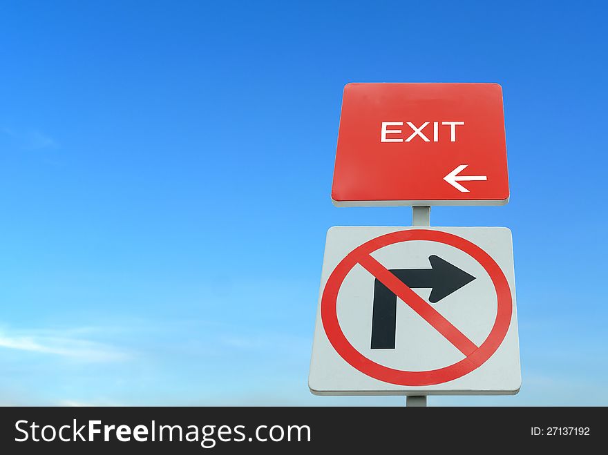 Red and white traffic sign in blue sky