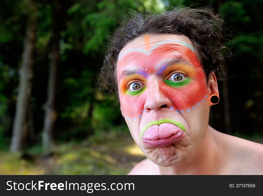 Indian Wearing Face Paint Showing His Tongue