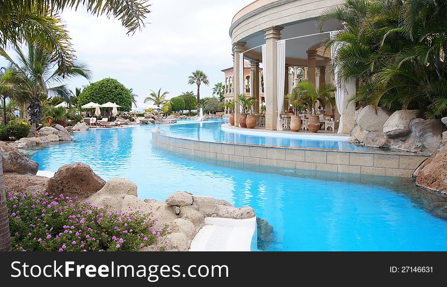 Spain Tenerife hotel with swimming pools, beach, palms, and the ocean. Spain Tenerife hotel with swimming pools, beach, palms, and the ocean