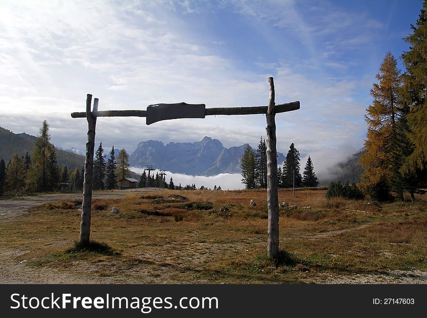 A big wooden gate in the mountains of Italy